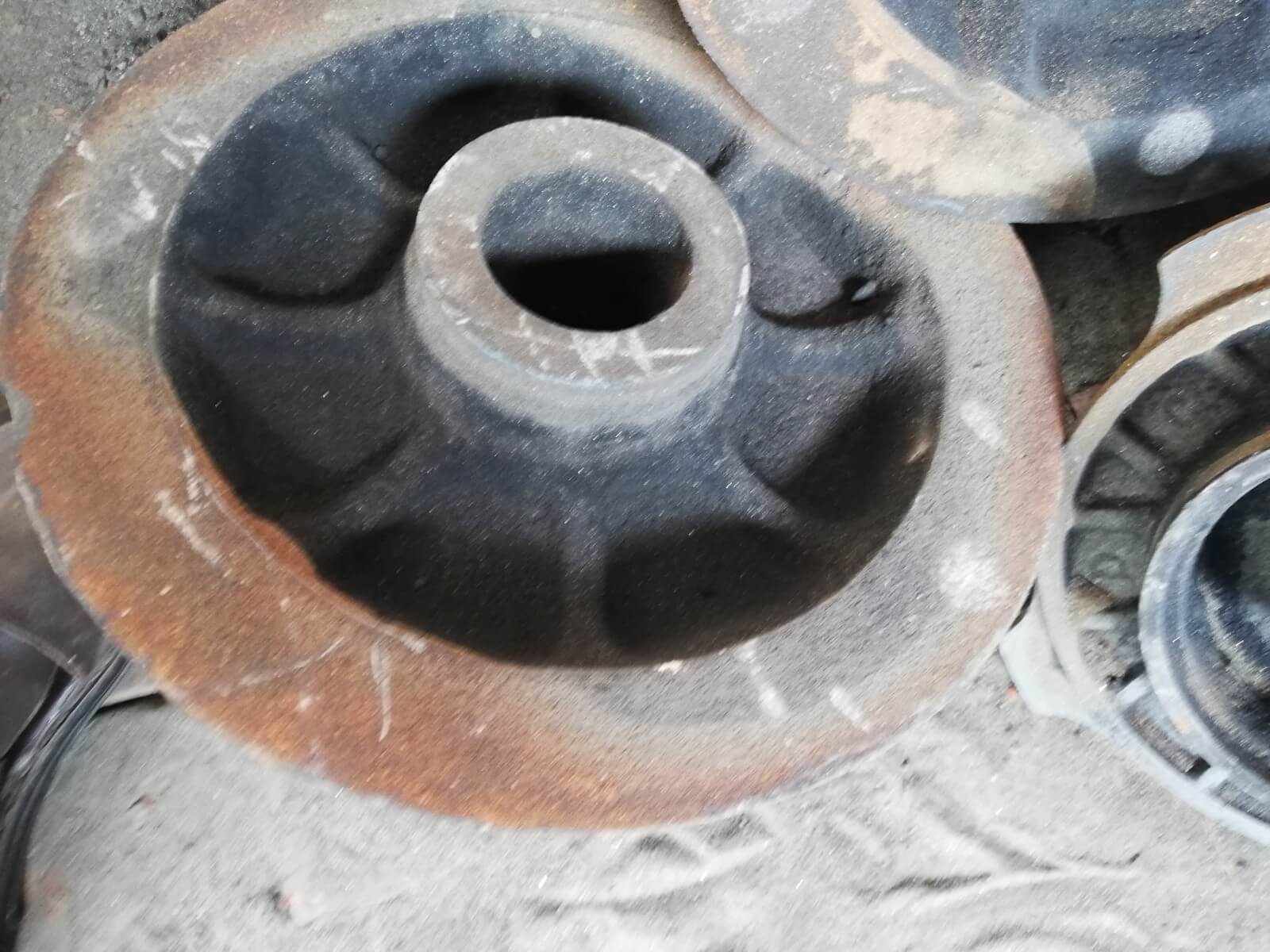 metal casting hub close up, rickshaw and loader disk break and disk hubs, wheel hub or casting steel hub